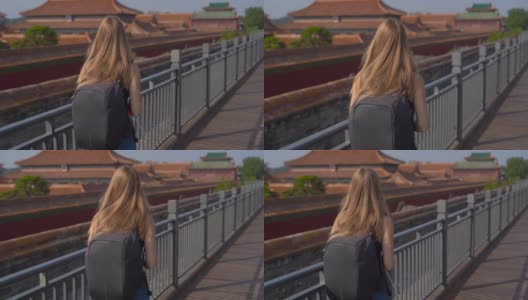 慢镜头斯坦尼康拍摄的一个年轻女子旅行博客访问紫禁城-中国皇帝的古代宫殿高清在线视频素材下载