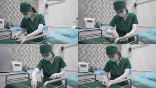亚洲华裔女医生正在准备手术工具。高清在线视频素材下载