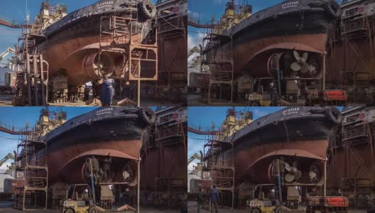 工人们在船厂的浮船坞修理旧船。船舶螺旋桨重建。渔船焊接延时全高清视频高清在线视频素材下载