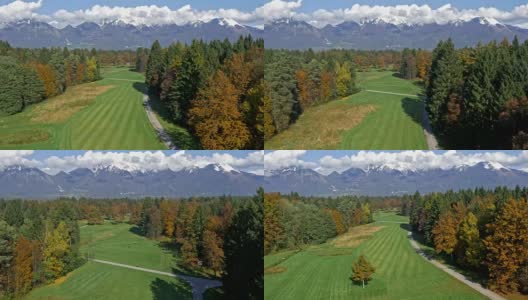 空中高尔夫球场与山的背景高清在线视频素材下载
