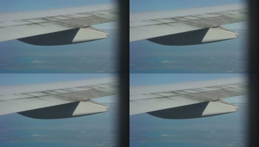 从飞机窗口的机翼近距离观察高清在线视频素材下载