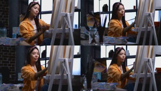 女艺术家正在艺术工作室绘画高清在线视频素材下载
