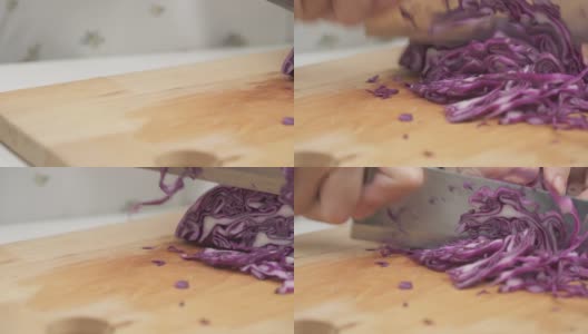 用手切碎的紫甘蓝放在桌上高清在线视频素材下载