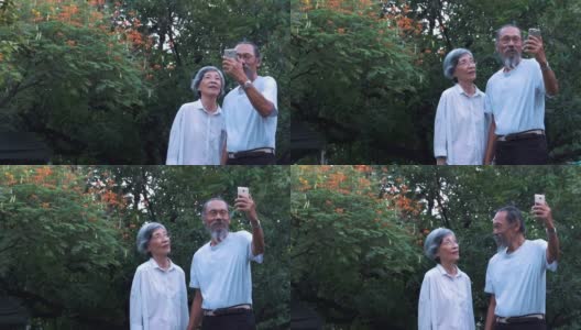 亚洲老夫妇在家用智能手机自拍高清在线视频素材下载