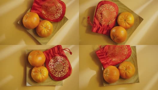 俯视图中国新年节日装饰。幸运袋和橘子高清在线视频素材下载