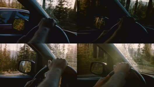 美丽的特写镜头，两个男性的手握着汽车方向盘驾驶在约塞米蒂森林道路上的慢动作。高清在线视频素材下载