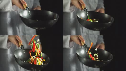厨师用炒锅炒蔬菜高清在线视频素材下载