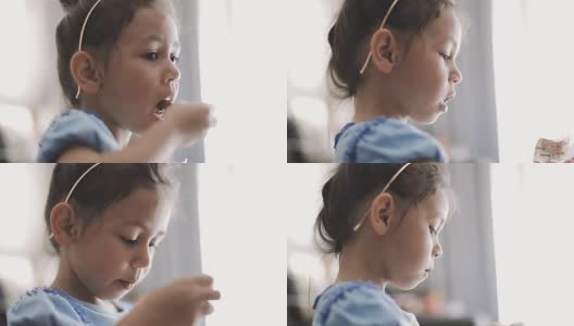 有趣的小女孩吃蛋糕高清在线视频素材下载