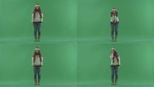 性感的年轻女人在圣诞帽送空气吻，色度键的背景高清在线视频素材下载