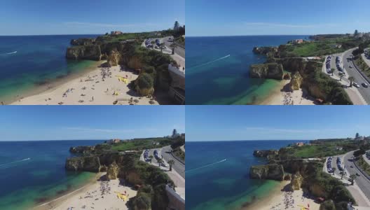 海洋和海滩附近的悬崖葡萄牙拉各斯鸟瞰图高清在线视频素材下载