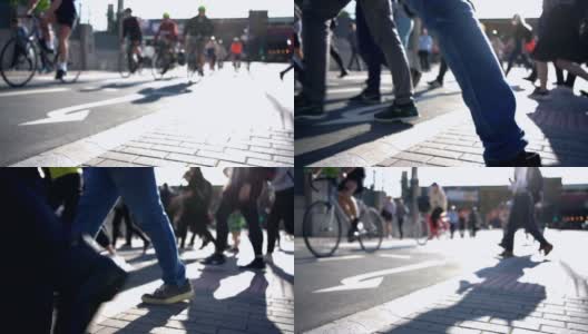 骑自行车的人和行人在城市上班的路上慢动作过马路高清在线视频素材下载