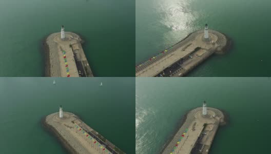 阳光明媚的一天时间青岛城湾著名的灯塔码头架空倾倒全景4k中国高清在线视频素材下载