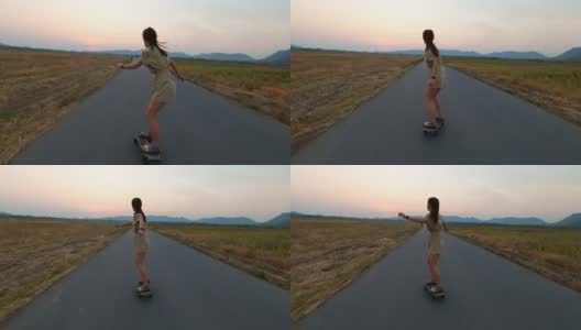 女子亚洲滑板在山路，冲浪滑板高清在线视频素材下载