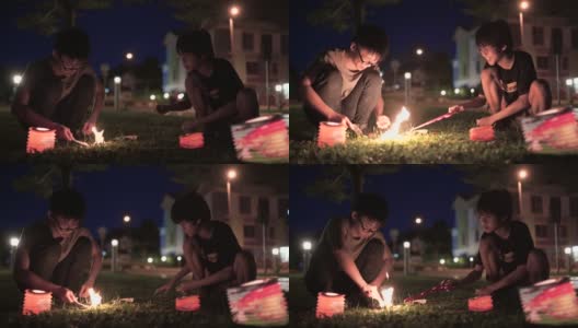 亚洲华人青少年用纸灯笼庆祝中秋节。高清在线视频素材下载