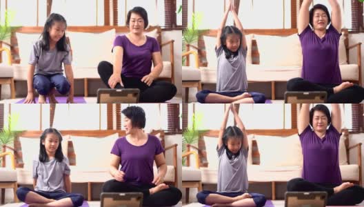 亚洲母亲和女儿在家里做瑜伽快乐高清在线视频素材下载