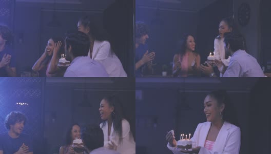 在家聚会时，女人给朋友送生日蛋糕高清在线视频素材下载
