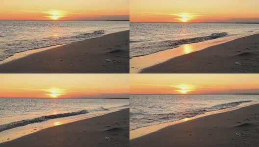 日落时平静的大海。夏日的黄昏海滨高清在线视频素材下载