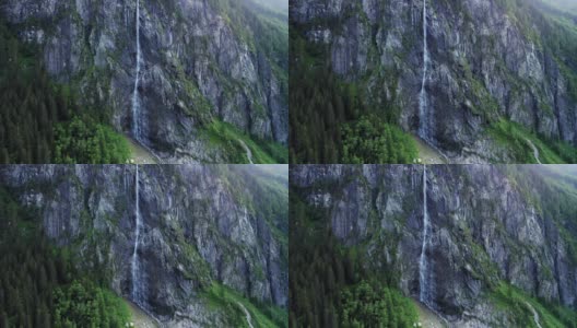 鸟瞰图，美丽的瀑布从悬崖上坠落到奥地利蒂罗尔的斯蒂勒普湖高清在线视频素材下载