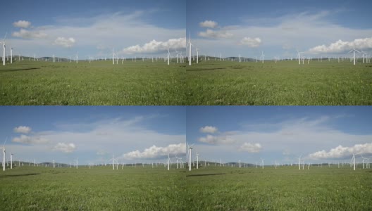 蓝天下旋转的风力涡轮机和草地，实时。高清在线视频素材下载