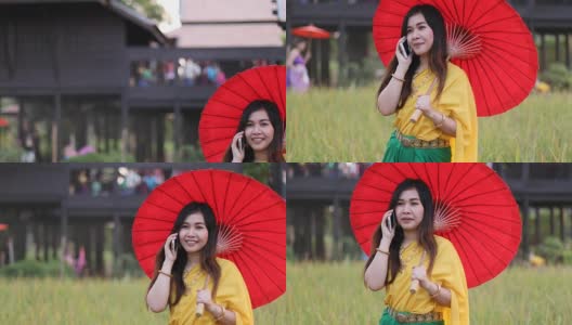 泰国妇女穿着传统风格拿手机高清在线视频素材下载