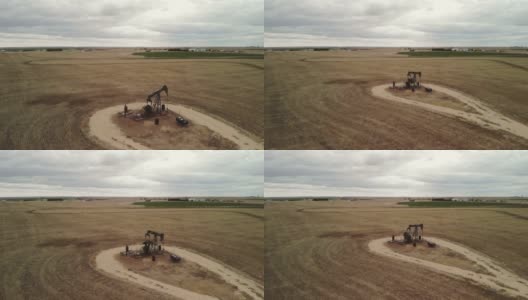鸟瞰图在早春风暴油田和中西部农业4K视频高清在线视频素材下载
