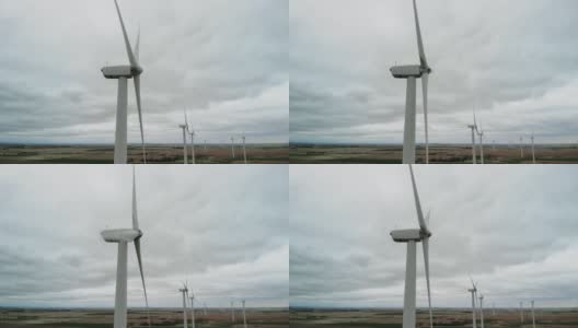 鸟瞰图在早春风暴风力涡轮机和中西部农业4K视频高清在线视频素材下载