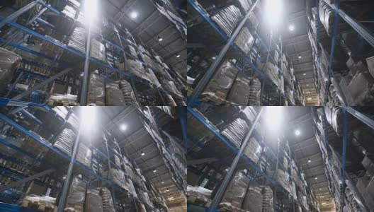 相机在仓库里的纸箱架子上移动高清在线视频素材下载