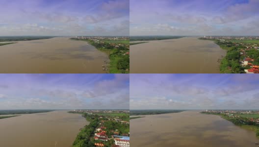 空中:飞回来，映出河边的村庄，云的影子掠过湄公河高清在线视频素材下载