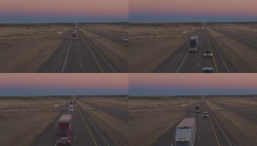 航拍图:黎明时分，卡车货运和汽车在公路上行驶高清在线视频素材下载