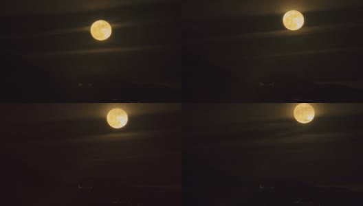 夜晚从山后升起的满月(或超级月亮)的时间间隔高清在线视频素材下载