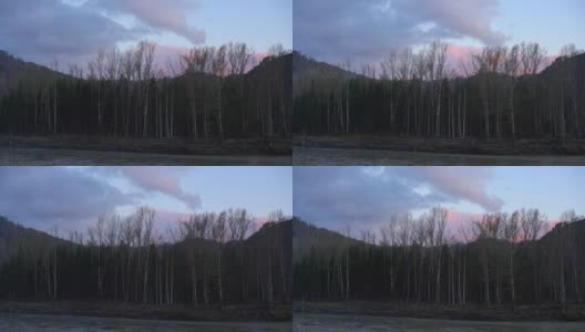河岸边的森林，山的背景和天空与飞行的云高清在线视频素材下载