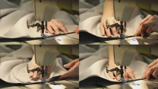 在缝纫机前工作的女人，缝纫机，女性的手，慢动作视频，特写，浅景深，工业缝纫机高清在线视频素材下载