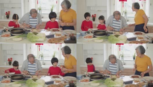 手持拍摄亚洲家庭烹饪厨房在新年高清在线视频素材下载