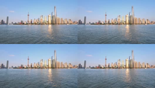 从外滩、摩天大楼和地标建筑眺望上海天际线，蓝天背景，黄浦江上平静的波涛，4k镜头，慢镜头。高清在线视频素材下载