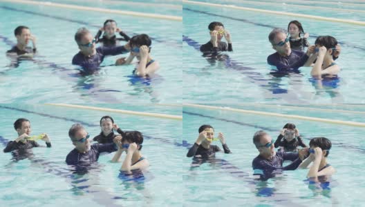 亚洲华人活跃的老人戴着泳镜为他的妻子准备班级社交距离高清在线视频素材下载