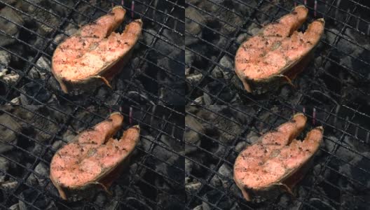 烤制鲑鱼。烤鲑鱼，鳟鱼，红鱼排高清在线视频素材下载