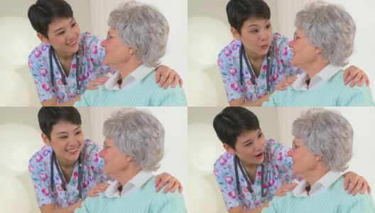 中国护士愉快地与老年病人交谈高清在线视频素材下载