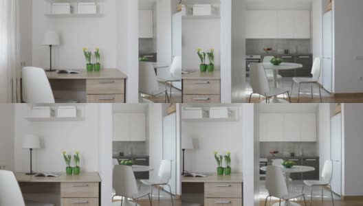 4 k。斯堪的纳维亚风格的现代公寓内部配备厨房和工作场所。运动全景高清在线视频素材下载