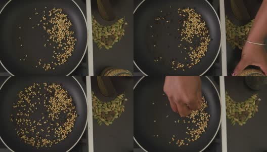 厨师在平底锅中加入香料并搅拌高清在线视频素材下载