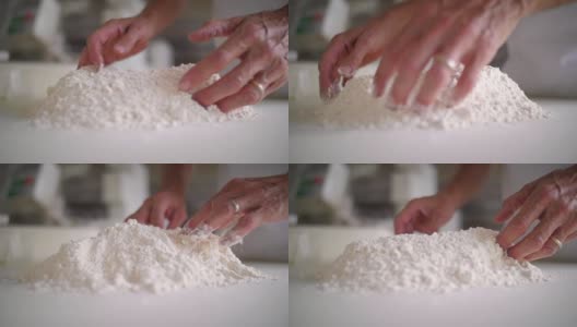 面包师的手在揉面粉高清在线视频素材下载
