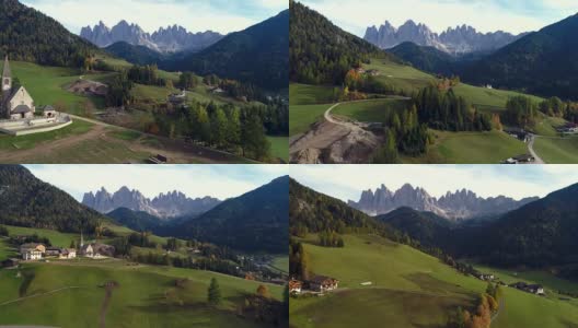 美丽的阿尔卑斯山村，绿色的草地和牧场，山峰。南蒂洛尔的多洛米提阿尔卑斯山高清在线视频素材下载