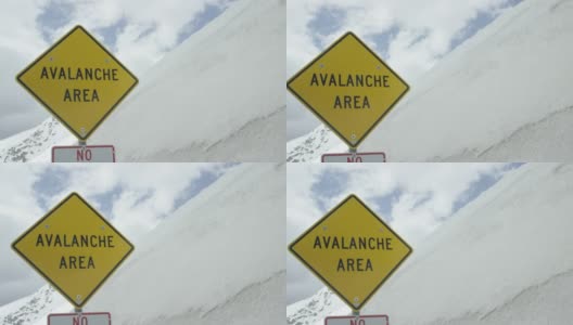 “雪崩地区”警告路标在科罗拉多州的落基山脉下阴天在冬天高清在线视频素材下载