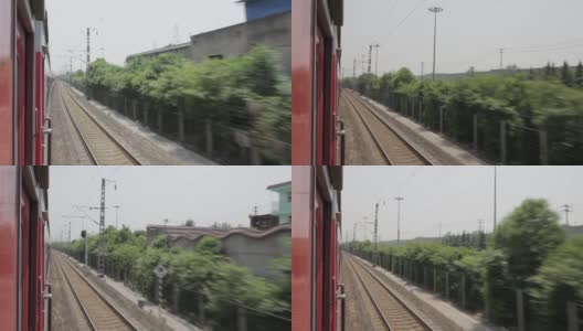 中国陕西西安，一列火车沿着铁轨行驶高清在线视频素材下载