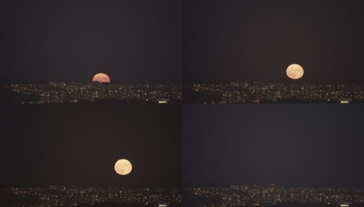 升起的超级满月在夜晚的城市。高清在线视频素材下载