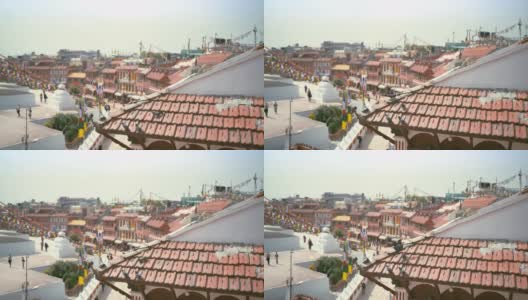 尼泊尔加德满都，鸽子群在屋顶瓦片上行走，在博德纳斯塔广场上飞出飞回的4K视频。高清在线视频素材下载