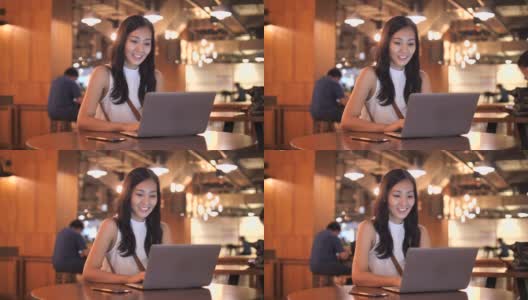亚洲ฺ女商人在咖啡馆使用笔记本电脑高清在线视频素材下载