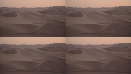 黄昏时分的秘鲁沙漠景观，以四速车为背景高清在线视频素材下载