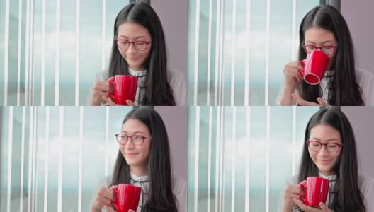 迷人的年轻商务女性享受一杯新鲜的咖啡放松和喝咖啡在办公室工作的地方高清在线视频素材下载