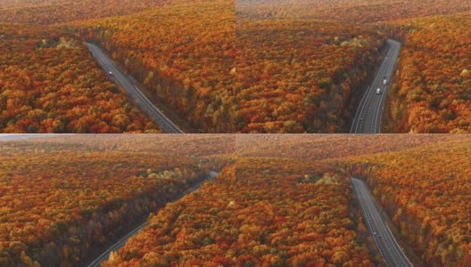 高速公路上的群山在清晨，夕阳刚落，就进入了五彩缤纷的秋季。无人机视频与加速平移摄像机运动。高清在线视频素材下载