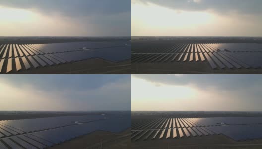 早春日落时分，无人机拍摄到太阳能农场的大型太阳能电池板。太阳能电池发电厂。录像视频4 k。高清在线视频素材下载